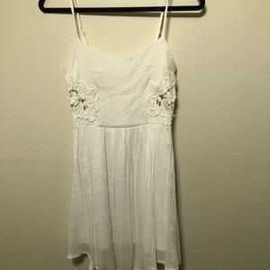 White dress with lace detail cutouts